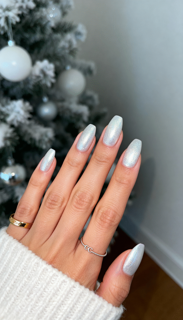 10. Silver Moonbeam Glow silver-moonbeam-glow-christmas-nail-christmas-nails-festive-nails-nail-designs-xmas